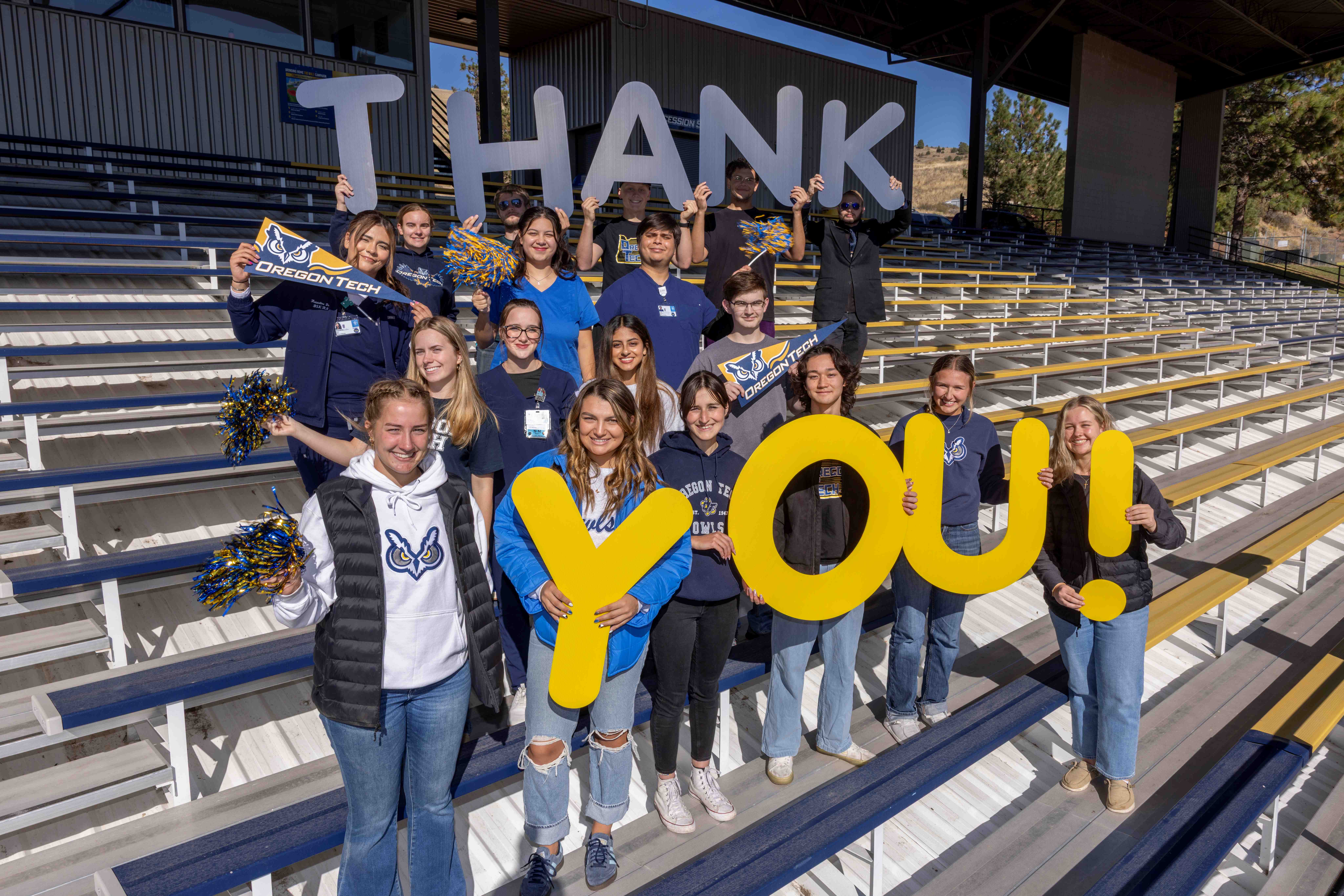 Students holding thank you sign