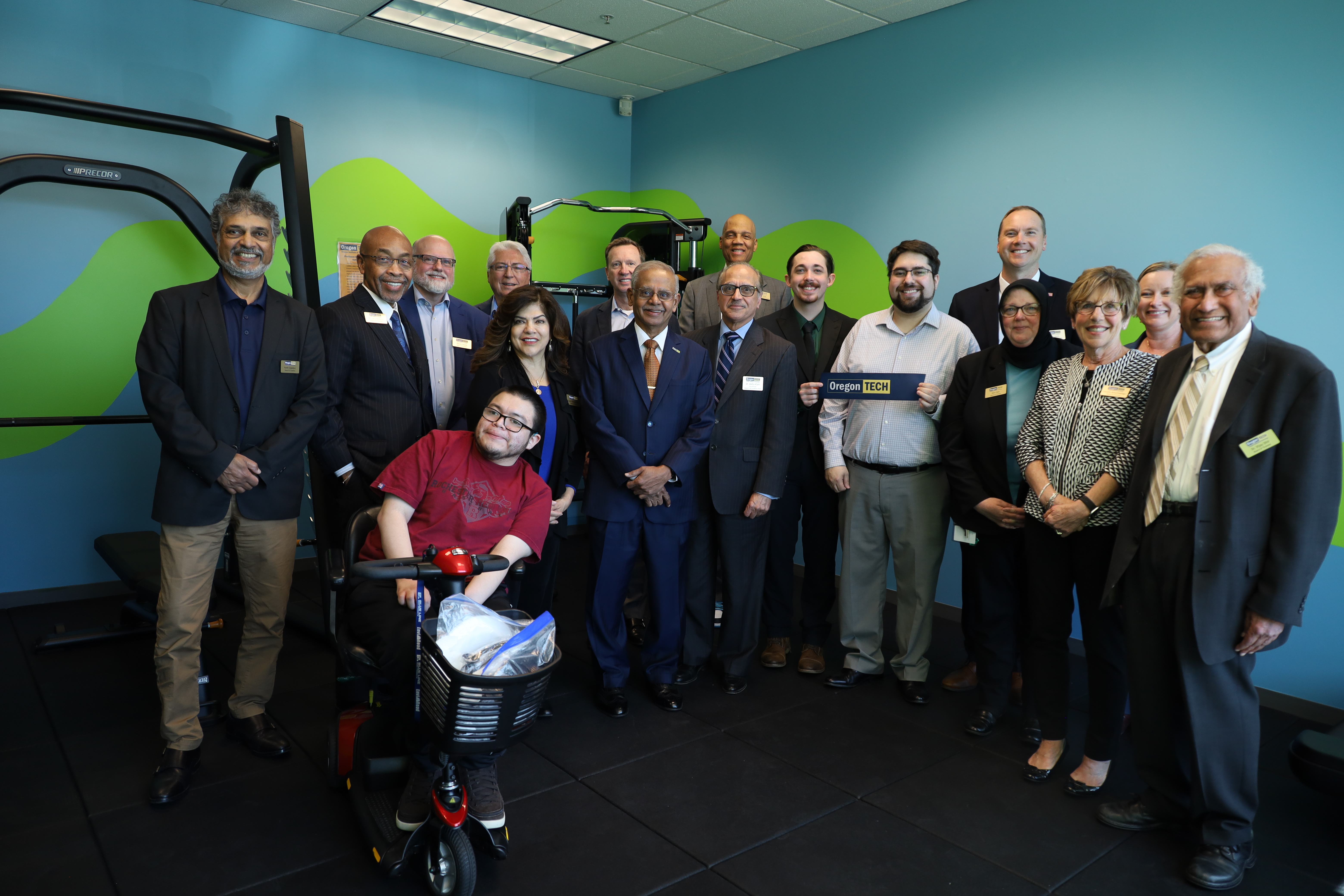 The attendees of the PM Fitness Center Grand Opening celebration pose in front of the new Smith Machine on April 8 2026.