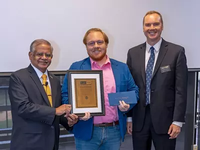 Faculty member receiving an award