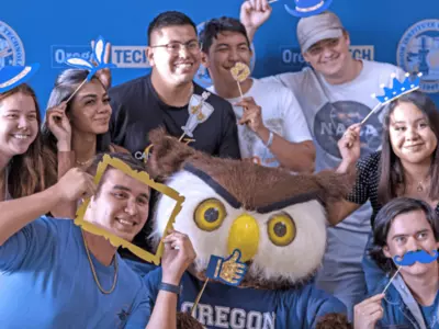 Oregon Tech students pose for a photo booth.