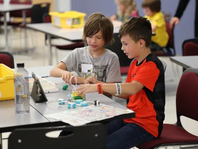 Students work together to code a robot