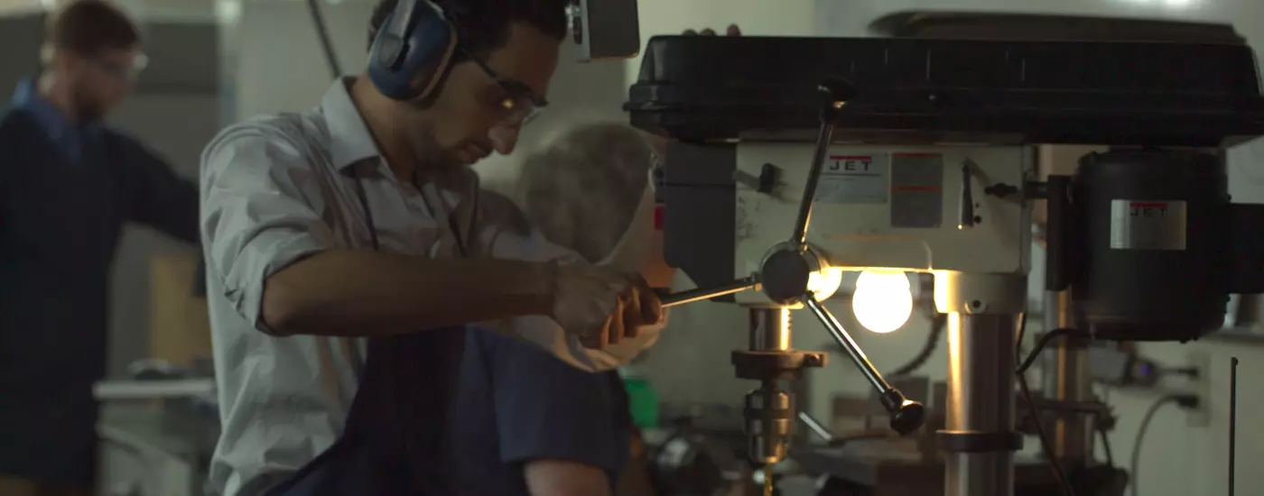 Student using drill press