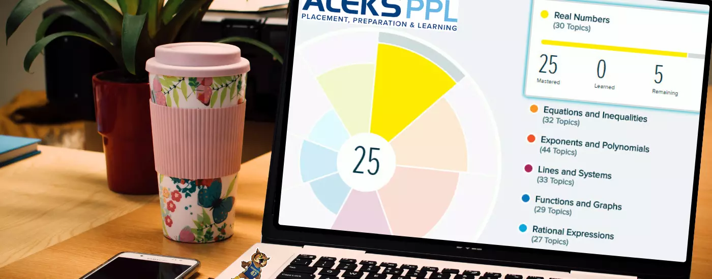 Image shows a laptop workstation with a laptop screen showing a webpage with the ALEKS Score Chart.
