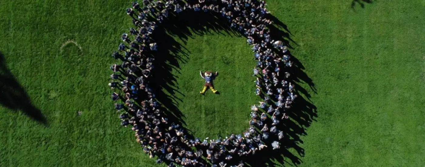 Students created an "O" around our favorite mascot, Hootie, during the SOAR program.