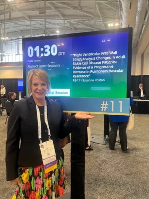 Sue Poston showing press title at event