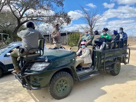 Beaudry on a game drive with student in the Field Guide program