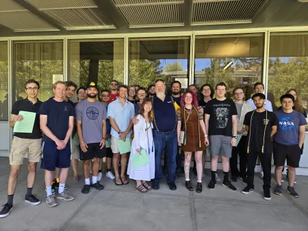 Professor Todd Breedlove with graduates at 2026 Commencement