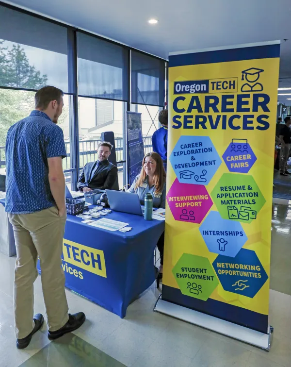 Student checking in at a career fair